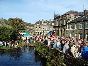 Crowds along the canal in the centre of Marsden during festival weekend 2016